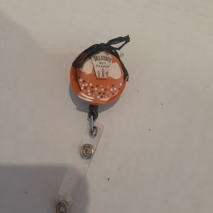 Retractable name badge holder
